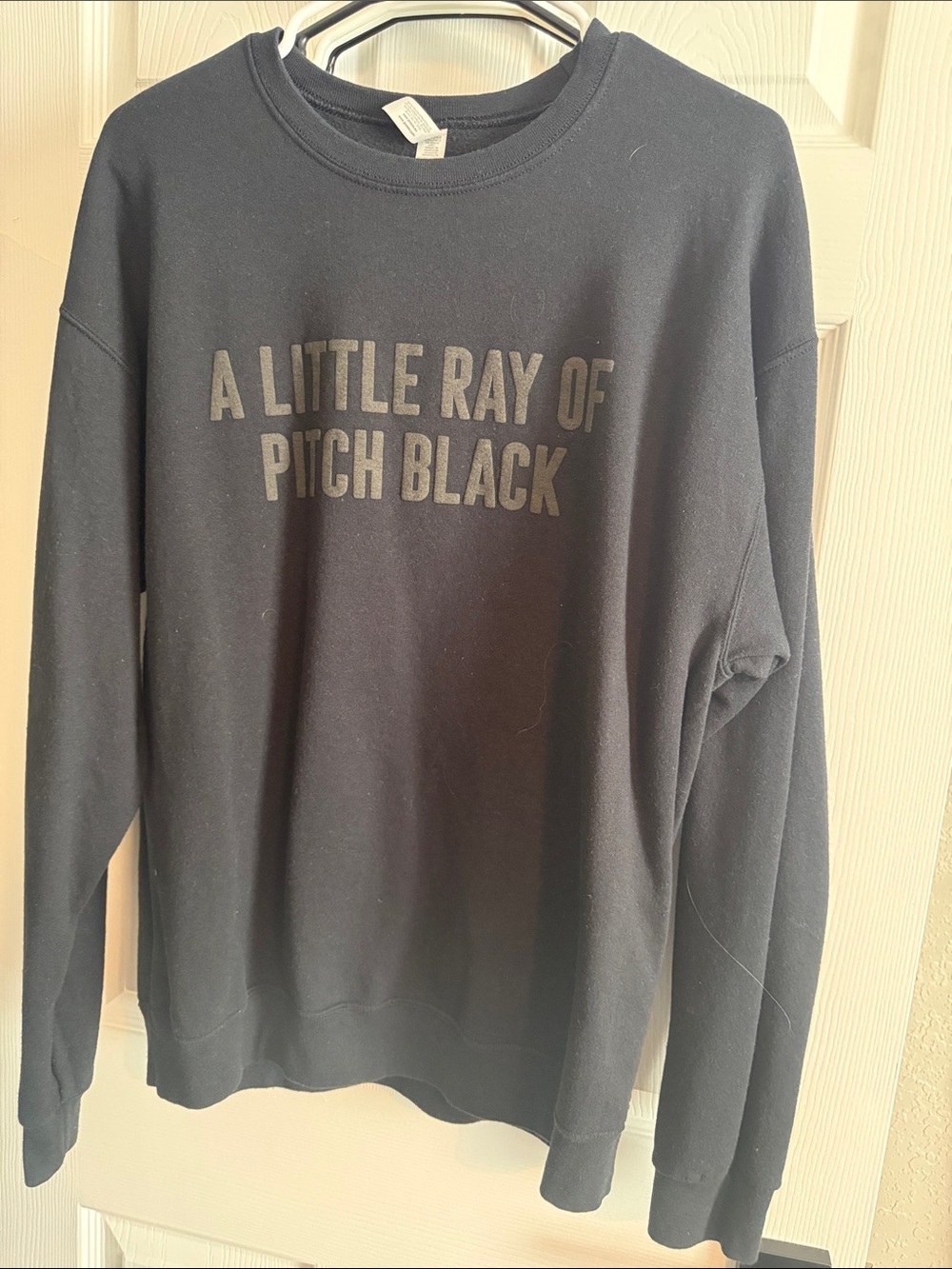 Women's Black Crewneck Sweatshirt with 'A Little Ray of Pitch Black' Print